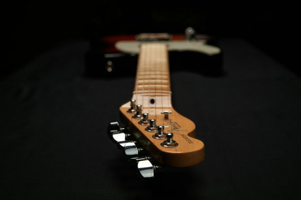a guitar with a black background